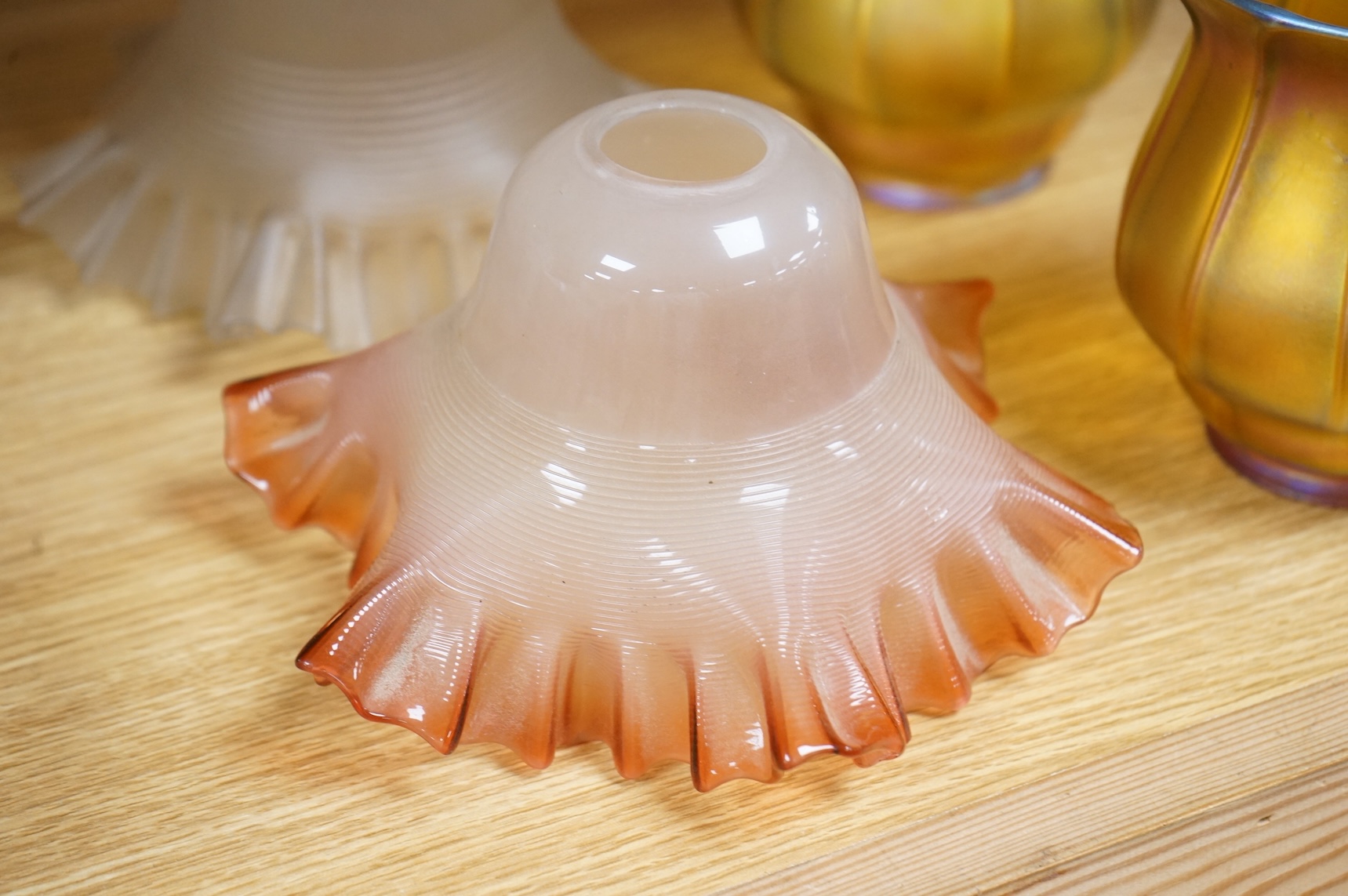 A pair of Quezal Art Glass iridescent light shades, and two frilled edged shades, Quezal shades 11.5cm high